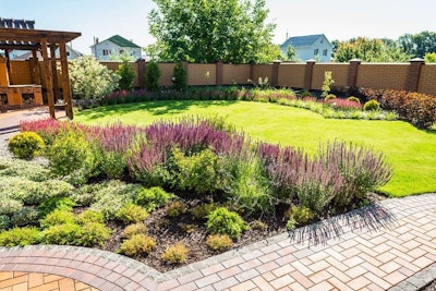 Hardscaping doesn’t have to include high walls to make an effect on noise reduction. When properly placed, short structures can be equally effective.