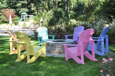 A natural stone veneer firepit with a bluestone cap provides a cozy gathering spot. Photo: Heidi Miscovic, Borst Landscape and Design