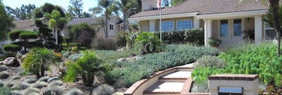 Hardscape, coupled with a variety of drought-resistant plants, replace the lawn at this Southern California home
