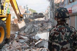 A JCB backhoe clearing debris in Kathmandu, Nepal, after their second earthquake.