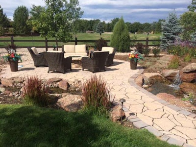 This firepit ties together multiple landscape elements for a cohesive design. Photo: Colorado Landscapes Unlimited