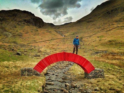 Alan Hinkes crosses PaperBridge in England’s Lake District. Photo: The Westmoreland Gazette.