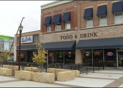 The patio at the Blue Bricks restaurant reopened the day after police shut it down for not having enough plants. Photo: The Mankato Times