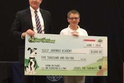 Winner Liam Ellis poses with OPEI President and CEO Kris Kiser