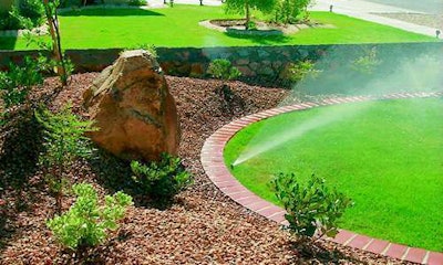 Mulch offers plenty of advantages, including aesthetic benefits such as those seen here, but take care to keep it from touching the base of trees and shrubs. Photo: Total Lawncare & Landscape Services.