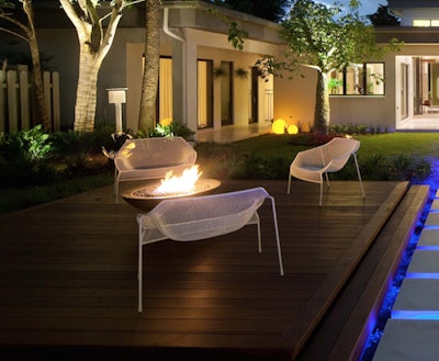 At $2,225, this modern fire-pit vessel features lava rock and serves as the focal point of an outdoor space created by Phil Kean Designs. Photo: Melissa Jones
