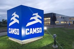 The new brand logo is seen here in a nighttime photo of the sign outside a company plant. Camso calls itself the “Road Free Company.” Photo: Camso