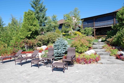 Drost’s landscaping projects boast far more than extraordinary water features, as the hardscape and plantings here illustrate. Still, the effective use of large stones helps mark the work as a Drost design. Photo: Lauren Heartsill Dowdle