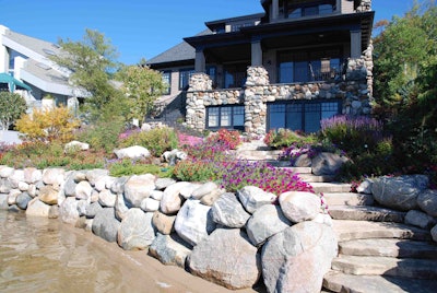 In this project, the use of large stones in the landscape design echoes the architecture of the home. Photo: Lauren Heartsill Dowdle