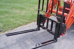 The forks can lift loads up to the loader’s operating capacity. Photo: Earth & Turf Products