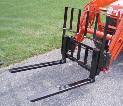 The forks can lift loads up to the loader’s operating capacity. Photo: Earth & Turf Products
