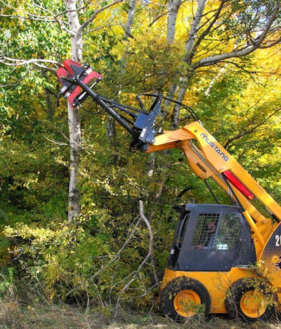 An Edge high-reach clipper attachment is fixed to a Mustang skid steer, another brand in the Manitou Americas family. Photo: Manitou Americas
