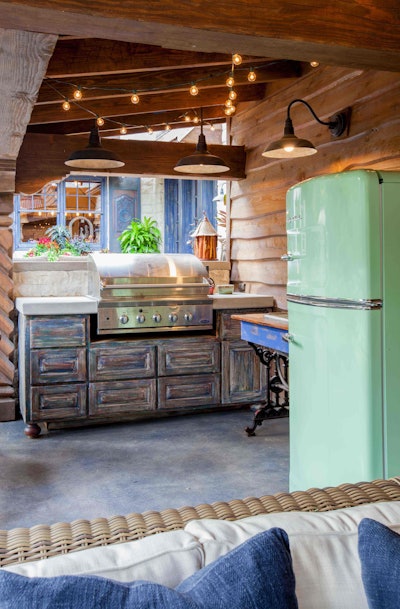 Adding a retro full-size fridge can bring both color and personality to your client’s outdoor kitchen. Photo: Key Residential (Lair Photography)