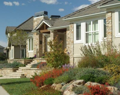 This xeriscape renovation replaced a bluegrass lawn with colorful perennials and shrubs. Photo: Matrix Gardens