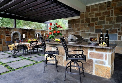 A kitchen bar creates extra seating and keeps the cook close to guests. Photo: houseideasblog.com