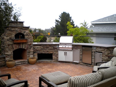 Pizza ovens are becoming popular patio installations and can make quite a statement in the landscape. Photo: houseideasblog.com