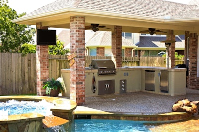 Covered areas keep the cook cool while playing with fire and can protect your client from unexpected showers. Photo: houseideasblog.com