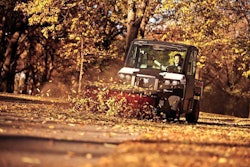 The broom attachment for this Bobcat 3650 utility vehicle angles up to 25 degrees right or left. Among other tasks, landscape contractors can use it to sweep leaves and debris from commercial clients’ parking lots and sidewalks. Photo: Bobcat