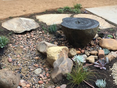 This water feature is an example of using a detailed focal point set against a background of simple shapes. Photo: Ketti Kupper