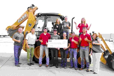 Southeastern Community College students and their instructors pose with the institution’s gift from CNH Industrial and Case Construction Equipment. Photo: Case