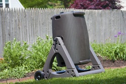 When the compost bin is locked in the horizontal position, it can be moved around like a wheelbarrow. Photo: Good Ideas