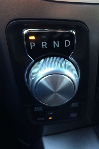 In the space saved by using a rotary gear-selection knob, designers provide a console that can accommodate your tablet, phone and other items. Photo: Equipment World