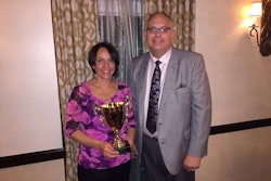 National floral design winner Dee Conrad poses alongside the National Alliance of Floral Associations’ Floral Design Contest chairman, Normal Northern.