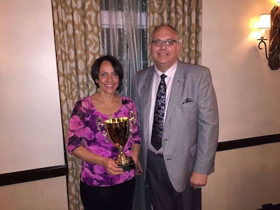 National floral design winner Dee Conrad poses alongside the National Alliance of Floral Associations’ Floral Design Contest chairman, Normal Northern.