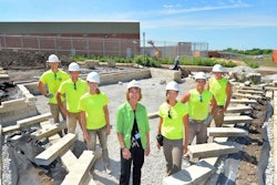 ISU students pose with ICIW Warden Patti Wachtendorf in one of the outdoor classrooms. Photo: Bob Elbert, Iowa State University