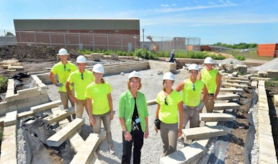 ISU students pose with ICIW Warden Patti Wachtendorf in one of the outdoor classrooms. Photo: Bob Elbert, Iowa State University