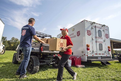 A Salvation Army volunteer unloads supplies from a Polaris Brutus UTV equipped with non-pneumatic tires. Photo: Polaris
