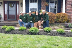 Kirk Brown, second from left, poses with his crew members. Kirk’s Lawn Care has grown steadily and Brown hopes to hire two more people next year.