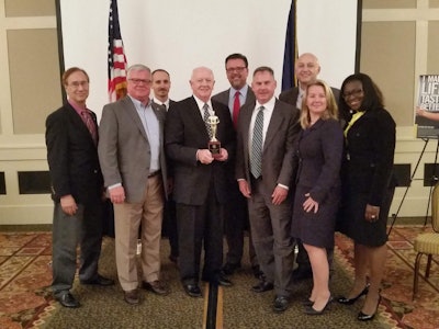 Stihl colleagues and members of the Virginia Manufacturers Association pose with Whyte following the award presentation.