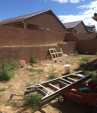 A “before” photograph from one of the more recent examples of Project EverGreen’s year-round efforts to facilitate the donation of landscaping services to wounded and disabled veterans and their families. (See the “after” shot below.)