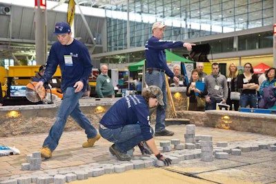 Students from the University of New Hampshire, along with their instructor, build a raised patio on the tradeshow floor at a previous year’s event. The 2015 New England Grows show is set for Dec. 2-4 in Boston. Photo: New England Grows