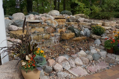 This waterfall, built into the woodland slope, adds a live element to the quiet oasis. Photo: Marcia Gruver Doyle