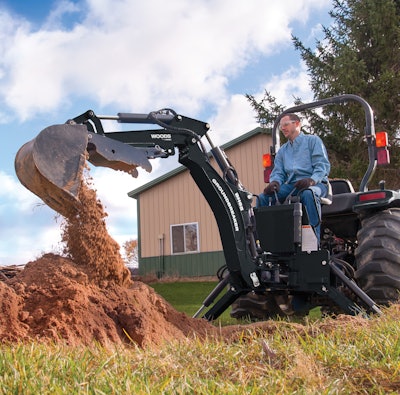The curved boom of the BH65 “Groundbreaker” backhoe improves visibility for the operator, the manufacturer says. Photo: Woods