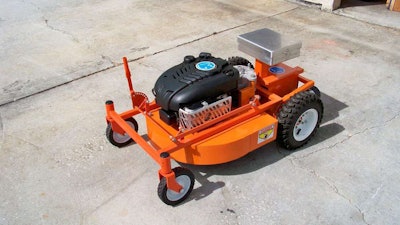 The Evatech MAGA robot is the part of this setup that has the larger wheels and silver device on top. Here, it’s connected to the mower attachment. Photo: Evatech