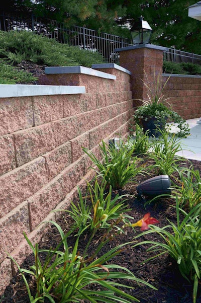 Extensive plantings on either side of a retaining wall, along with the wall itself, illustrate the company’s attention to quality and detail. Photo: Patty Pohuski