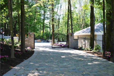 The hardscape work on this residential client’s driveway, coupled with the landscaping around it, shows off the company’s wide range of services.