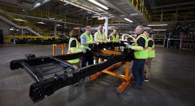 Ford’s five blue-collar customers inspect a Super Duty frame at its Dearborn Truck Plant. Photo: Ford Motor Co.