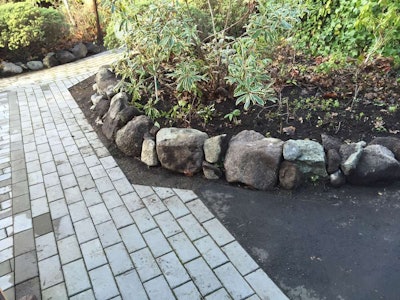 Island Pro Mowing & Landscaping says the clients for this garden and paver pathway job found the company through its website. Photo: Island Pro Mowing & Landscaping