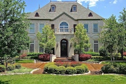 This home’s driveway features a decorative, stained surface from Concrete Craft. Photo: Concrete Craft