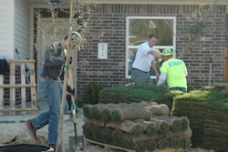 Volunteers from Project EverGreen, Turfgrass Producers International, the Brickman Group and Habitat for Humanity Houston lay sod and plant trees for five new homes. Photo: Project EverGreen