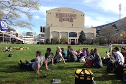 Students listen to instructor Rip Tompkins talk about the best practices of arboriculture. Photo: Jill Odom