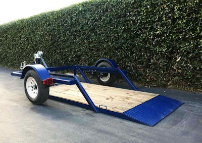 The trailer deck remains flat while it is raised or lowered with the hand-cranked winch. Photo: Airtow Trailers