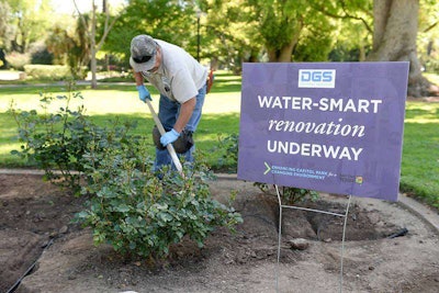 A Department of General Services Capitol Park groundskeeper adds drip irrigation to a park rose bed. Photo: California Department of General Service