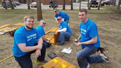 During the first “Doosan Days of Community Service,” employee volunteers renovated a playground at the North Dakota Autism Center in Fargo. Photo: Bobcat