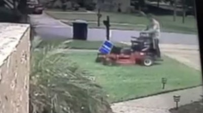 A screenshot of the video showing the landscaper mow down the Trump campaign sign. Photo: News 6