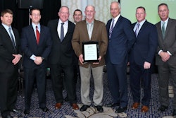 Posing with the company’s Achievement Award recipient are, from left, Phil Key, president; Tom Barry, vice president of Ruppert’s landscape management division; Bob Jones, president of the landscape construction division; Doug Halsey, regional vice president, landscape management division; the award recipient, Tony Youngblood, field manager, Georgia landscape construction branch; Craig Ruppert, chief executive officer; Jack Jones, region manager, landscape management division; and Chuck Whealton, region manager, landscape management division. Photo: Ruppert Landscape